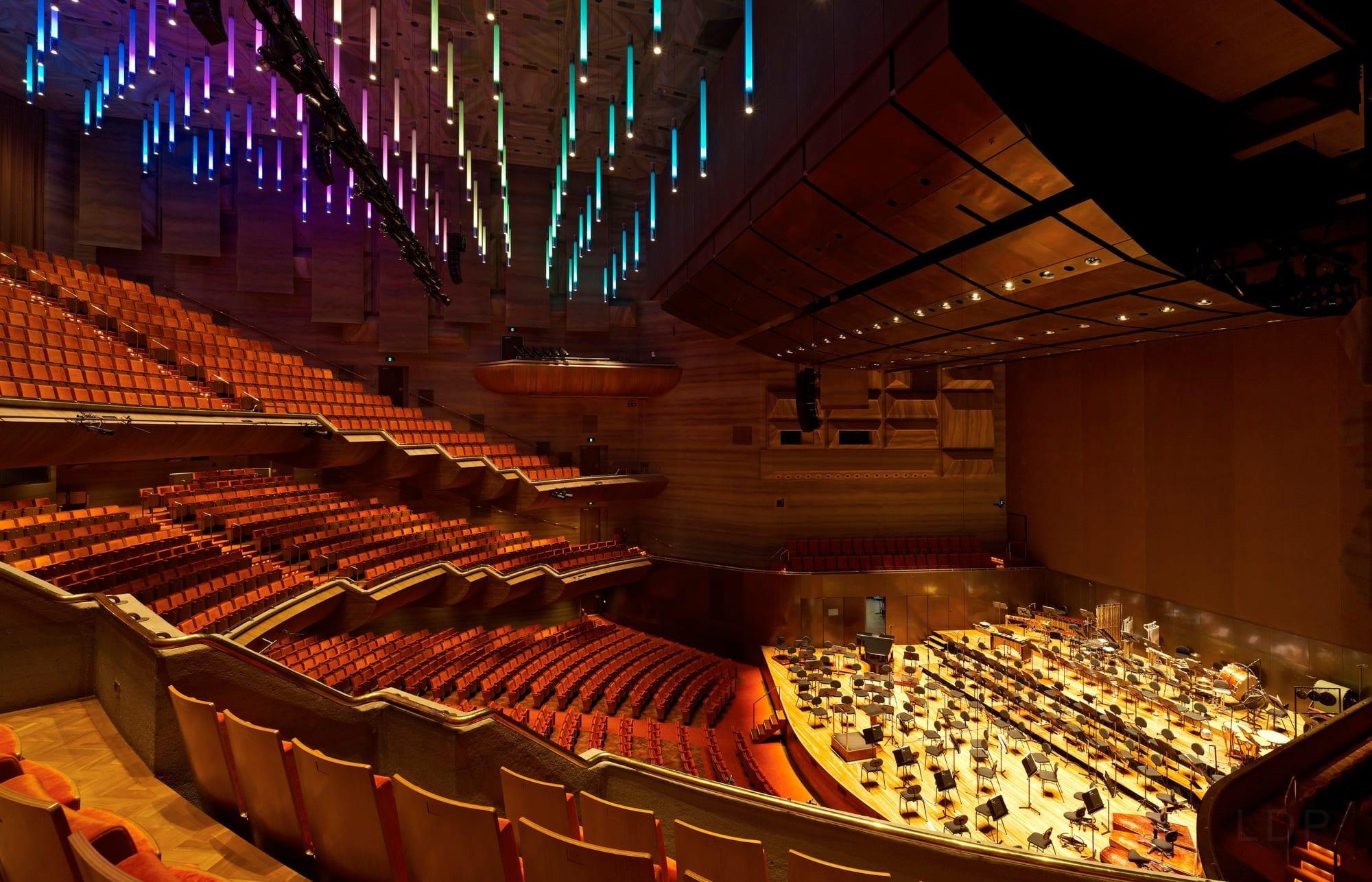 House lighting by day's work, a coloured sky by night — the same luminaires, retractable.